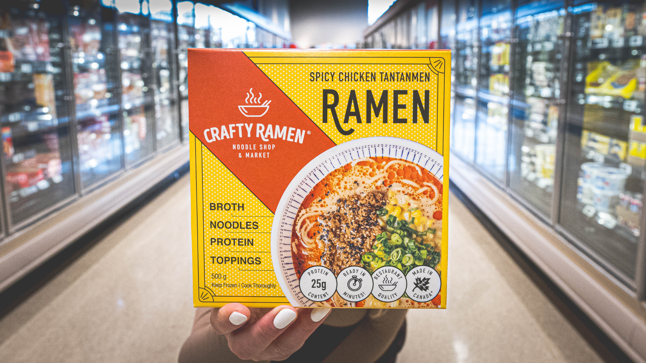 Spicy Chicken Tantanmen being held up in the freezer aisle