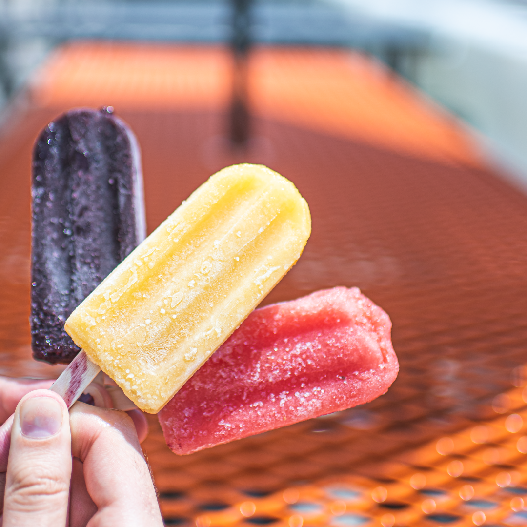 Three Crafty Pops held outside