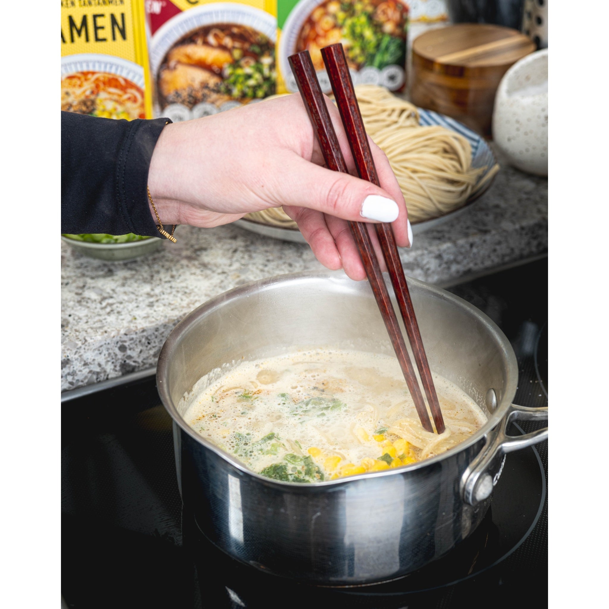 Frozen Ramen cooking in a pot on the stovetop 