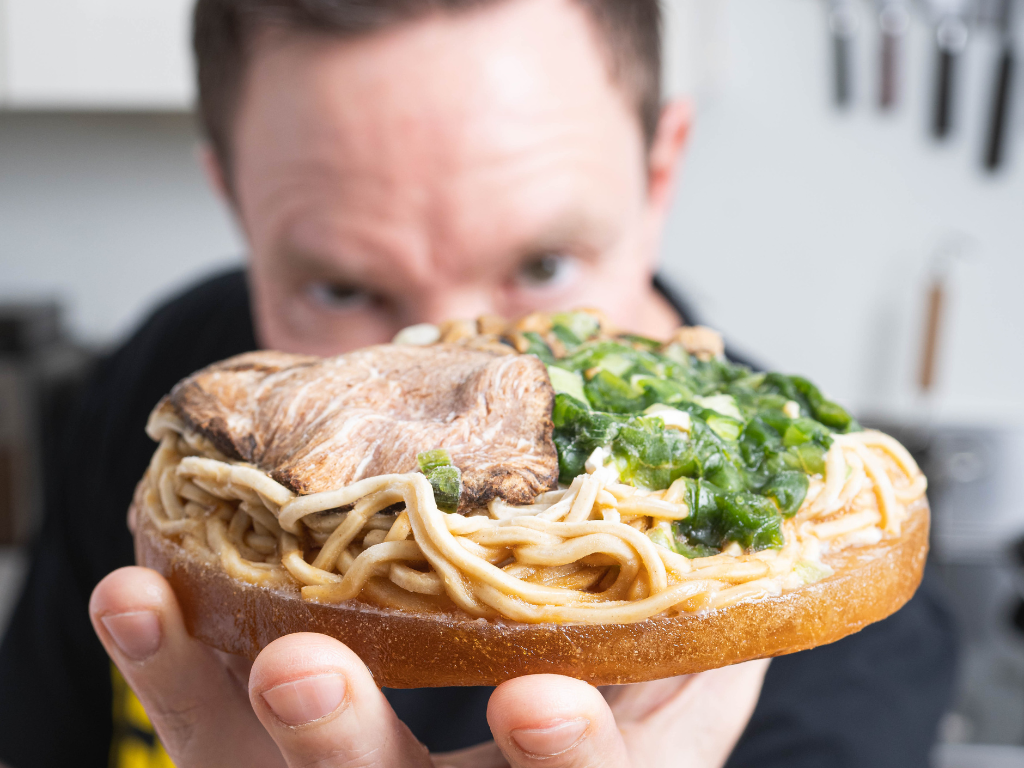 Chef Jared holding a Pork Shoyu Frozen Ramen puck