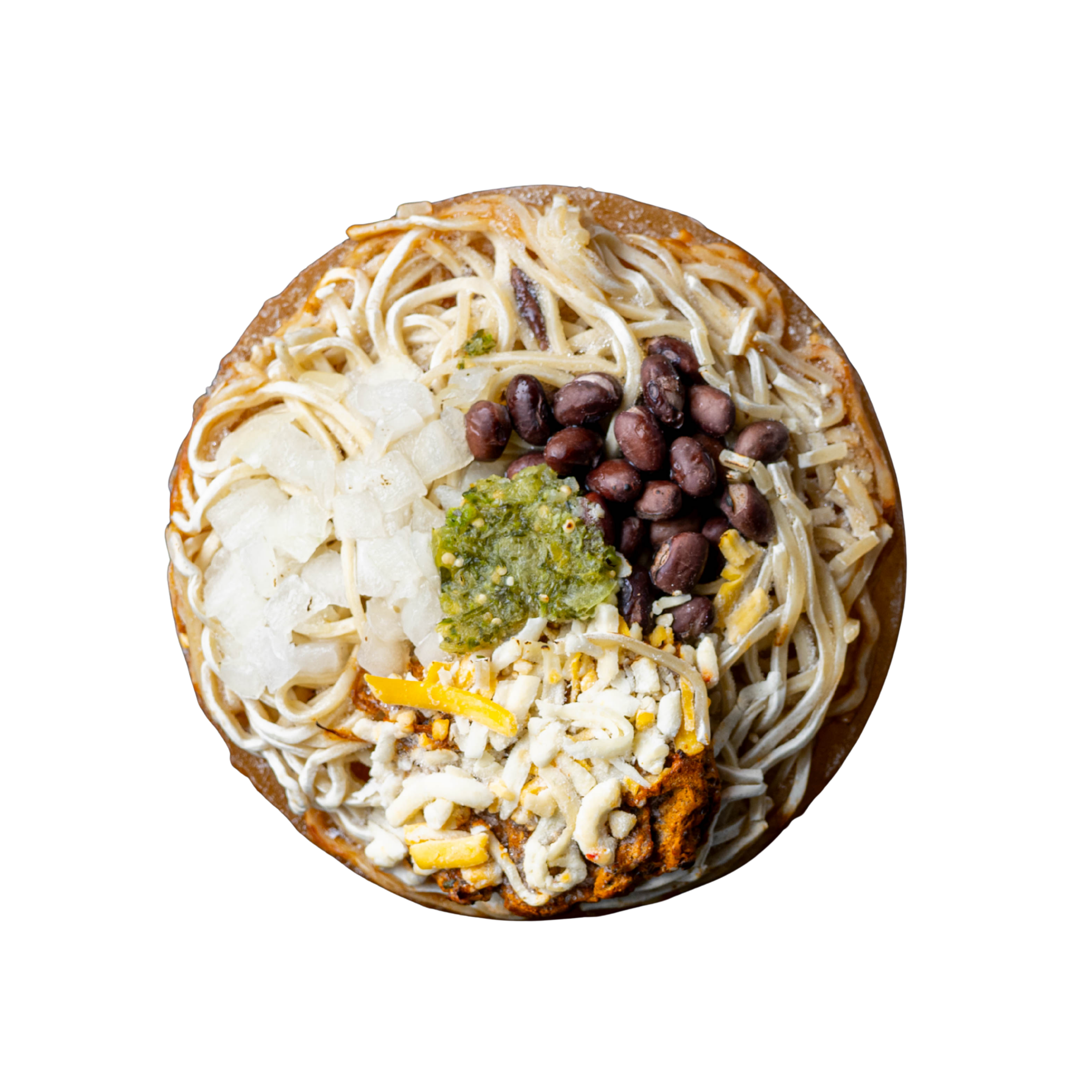 A top-down view of Brisket Birria Frozen Ramen puck with masa ramen noodles, birria broth, shredded white cheese, black beans, a dollop of green salsa, onions, brisket, and cheese.