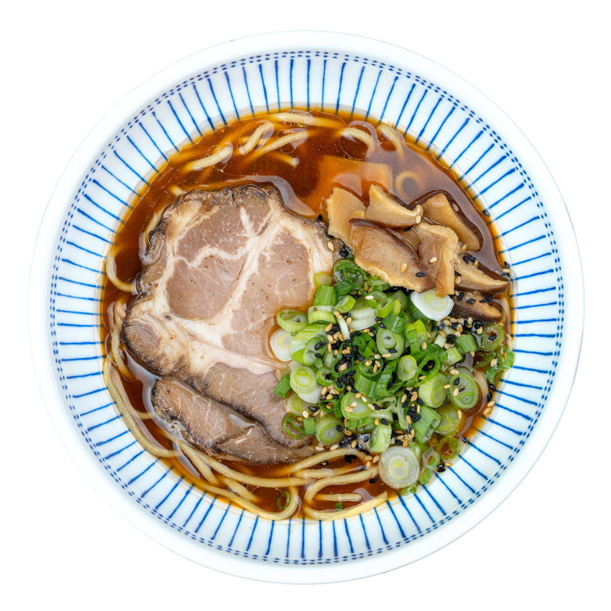 Shiitake Pork Shoyu Ramen with scratch-made noodles, real bone broth, sliced pork chashu, seasoned shiitake mushrooms, and green onions in a white bowl.