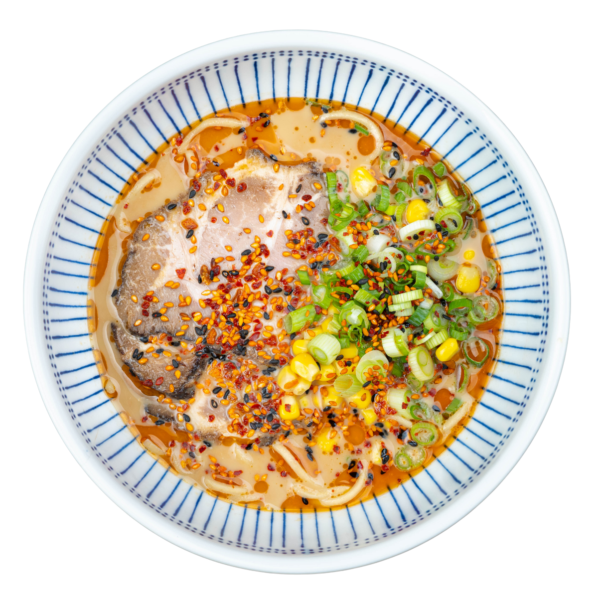 Spicy Pork Miso Ramen with scratch-made noodles, real bone broth, chili oil, sliced pork chashu, sweet corn, green onions, and chili crunch in a white bowl.